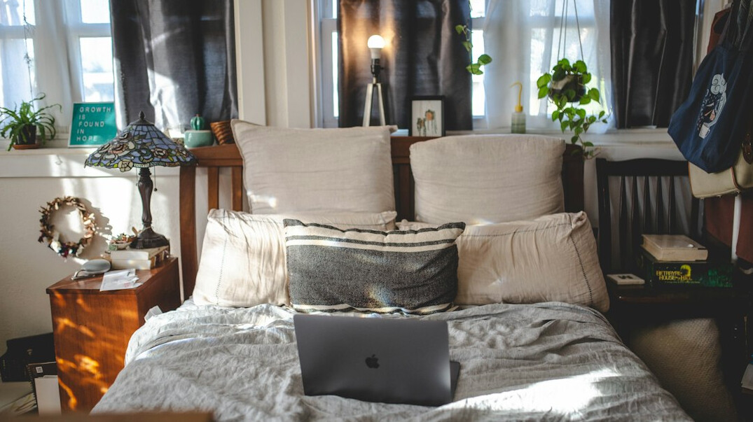 person using laptop for apartment search